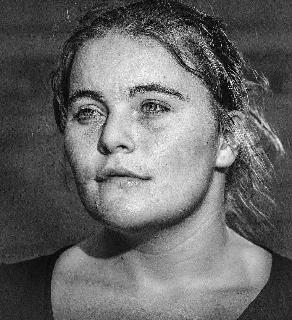 B/W photographic portrait of female homeless person for ad campaign